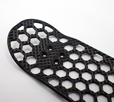 Metal fingerboard with machined grip in black.